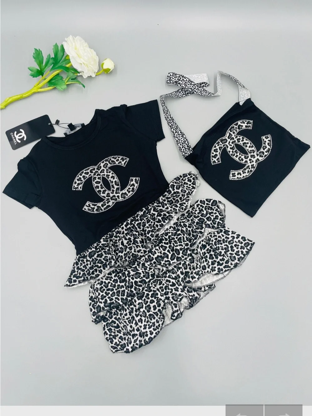 CHANEL Black Tee with Monochrome Leopard Ruffle Skirt & Pouch